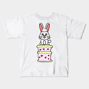 Funny rabbit jumping out of a cake Kids T-Shirt